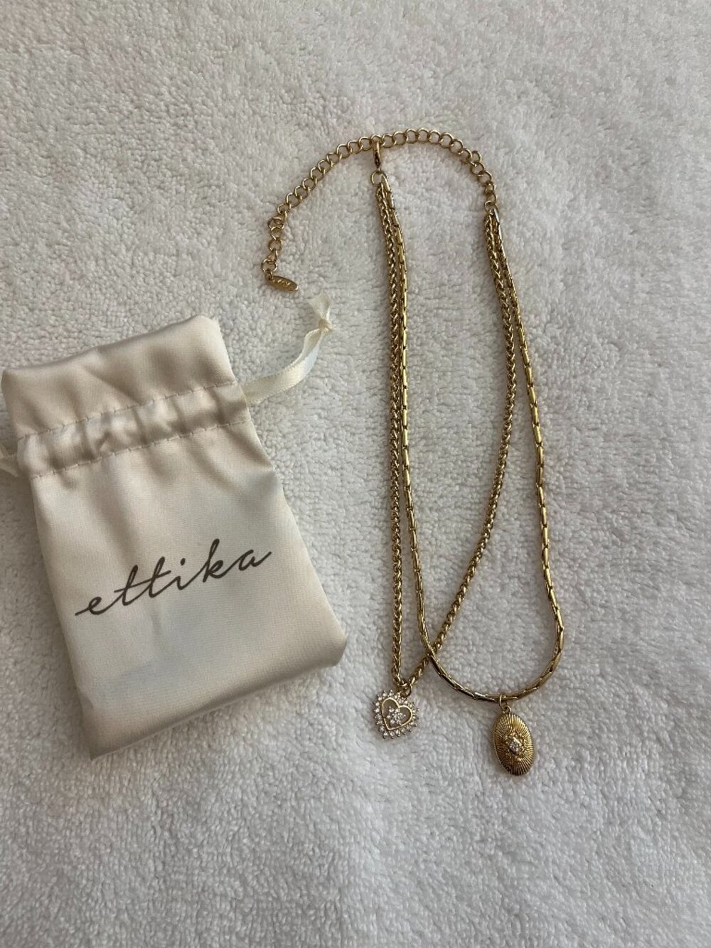 Ettika heart and oval pendant with finish layered necklace